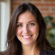 Professional headshot of Élodie Leroux, a cheerful female instructor.