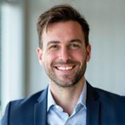 Professional headshot of Marc André, a male instructor with a friendly expression.