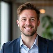 Professional headshot of Thomas Martin, a smiling male instructor.